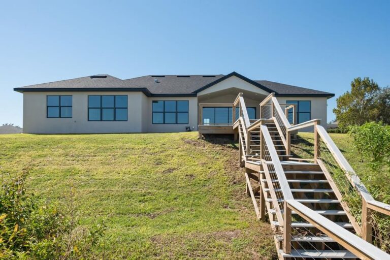 Covered stairs and outdoor living designed for a hillside custom home in Howey-in-the-Hills FL