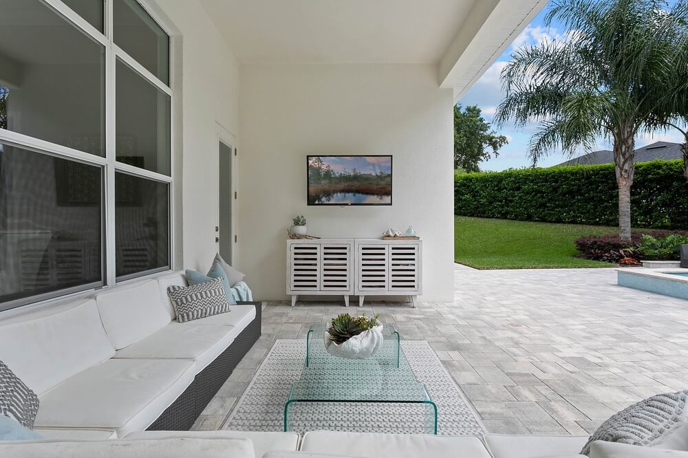 Covered outdoor living space designed for a custom home in Central Florida